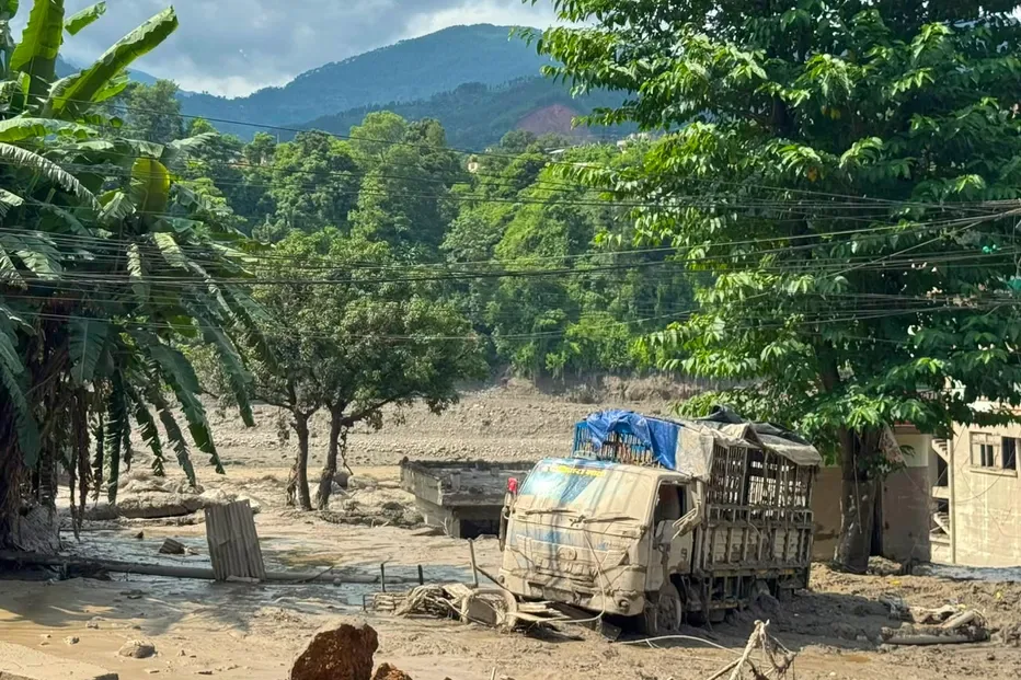 Damaged houses and vehicles are seen in the aftermath of flash floods along the Trishuli River in Nepal